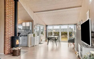 a kitchen and dining room with a fireplace in a house at Lovely Home In Thisted With Kitchen in Thisted