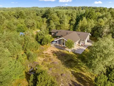 an aerial view of a house in the woods at Holiday Home Guri - 600m to the fjord by Interhome in Fur