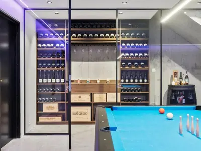 a pool table in front of a wine cellar at Holiday Home Ilja - 800m from the sea by Interhome in Blokhus