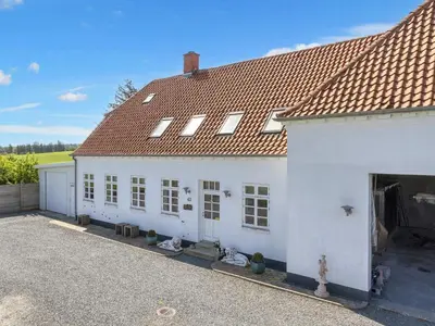 a white building with a red roof at 4 star holiday home in Thisted-By Traum in Thisted