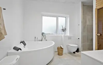 a white bathroom with a tub and a toilet at Gorgeous Home In Thisted With Wifi in Thisted