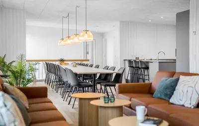 a living room with a couch and a table and chairs at Stunning Home In Løgstrup With Kitchen in Løgstrup