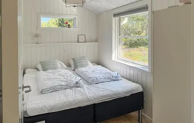 a bed in a room with a window at 3 Bedroom Cozy Home In Thisted in Thisted