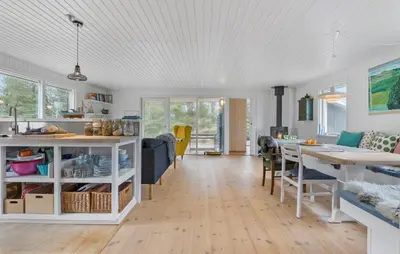 a kitchen and living room with a table and chairs at Awesome Home In Brovst With Wifi in Brovst