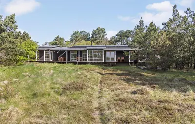 a house on top of a hill with trees at Nice Home In Hurup Thy With Wifi in Sindrup