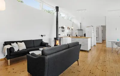 a living room with a couch and a table at Nice Home In Hurup Thy With Wifi in Sindrup