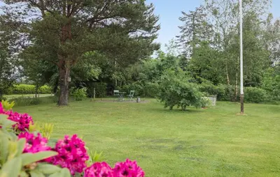 a park with pink flowers in the grass at 3 Bedroom Pet Friendly Home In Højslev in Højslev