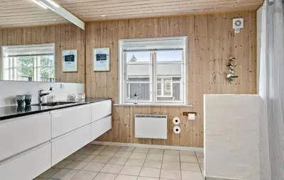 a kitchen with white cabinets and a window at 3 Bedroom Pet Friendly Home In Højslev in Højslev