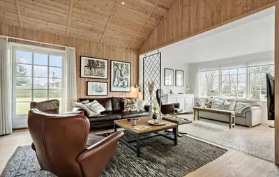 a living room with a couch and a table at 3 Bedroom Pet Friendly Home In Højslev in Højslev