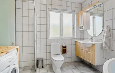 a bathroom with a toilet and a sink at 3 Bedroom Awesome Home In Vestervig in Vestervig