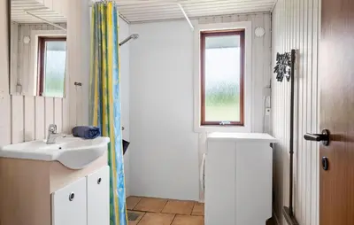 a bathroom with a sink and a shower at 3 Bedroom Stunning Home In Hurup Thy in Doverodde