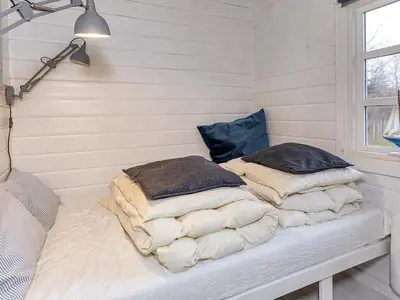 two pillows sitting on a bed in a room at 5 person holiday home in Vesløs-By Traum in Øsløs