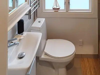 a bathroom with a white toilet and a sink at 5 person holiday home in Vesløs-By Traum in Øsløs