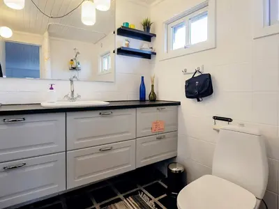 a bathroom with a white sink and a toilet at 5 person holiday home in Brovst-By Traum in Brovst