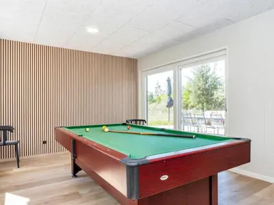 a billiard room with a pool table in a room at 5 star holiday home in Øster Assels-By Traum in Øster Assels