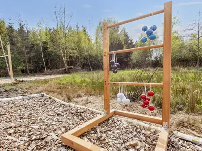 a playground with balloons and balls in a field at 5 star holiday home in Øster Assels-By Traum in Øster Assels