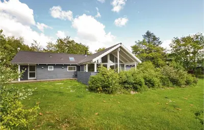 a house with a yard in front of it at Holiday Home Hjerm Gh-1983 in Hjerm