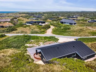 an overhead view of a house with a black roof at Holiday Home Kristiina - 500m from the sea by Interhome in Saltum