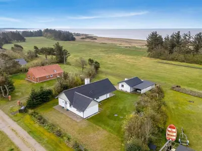 an aerial view of a house and a barn at Holiday Home Moreen - 200m to the fjord by Interhome in Vemb