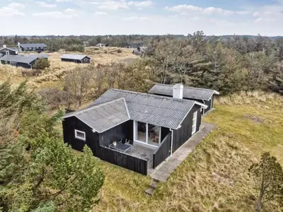 an overhead view of a black house on a hill at Holiday Home Florencia - 450m from the sea by Interhome in Løkken