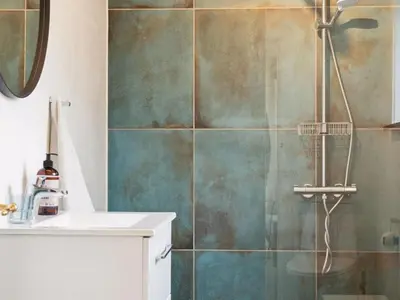 a bathroom with a shower and a sink at Holiday Home Birtir - 750m from the sea by Interhome in Hanstholm