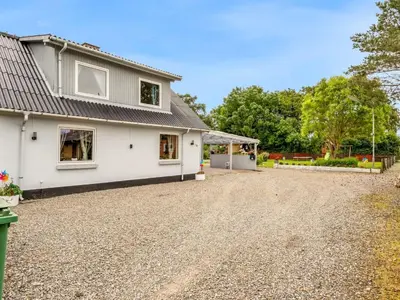 an image of a house with a gravel driveway at Holiday Home Elara - 300m from the sea by Interhome in Thyholm