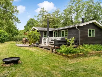 a cabin in the woods with a yard at Holiday Home Bonde - 800m to the fjord by Interhome in Farsø