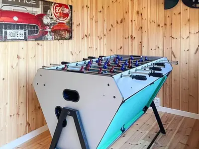 a foosball table in a room with a wall at 4 star holiday home in Løgstør-By Traum in Løgsted