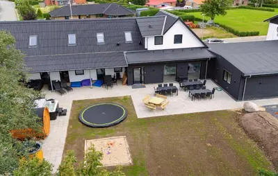 an aerial view of a house with a trampoline at Nice Home In Spøttrup With Sauna in Spottrup