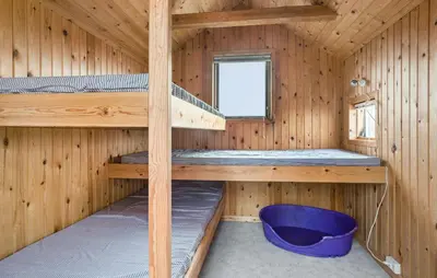a wooden cabin with two bunk beds in it at 3 Bedroom Pet Friendly Home In Frøstrup in Frøstrup