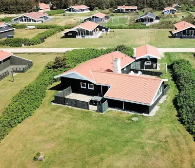 an overhead view of a house with a red roof at Spacious and well furnished pool house - SJ170 in Harboør