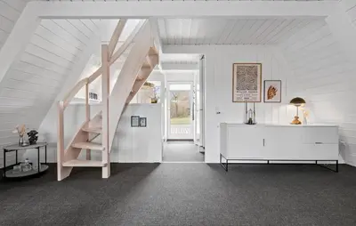 a white room with a spiral staircase in a house at Awesome Home In Farsø With Wifi in Farsø