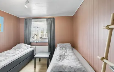 a small room with two beds and a window at Beautiful Home In Thisted With Wifi in Thisted