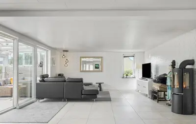 a living room with a couch and a tv at Beautiful Home In Thisted With Wifi in Thisted