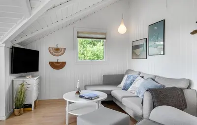a living room with a couch and a tv at Cozy Home In Vestervig With Wifi in Vestervig