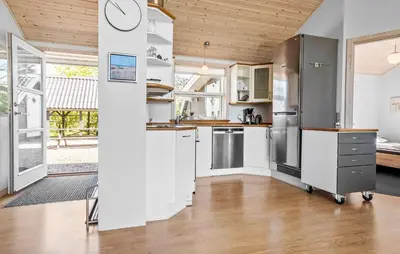 a kitchen with white cabinets and stainless steel appliances at 3 Bedroom Amazing Home In Vestervig in Vestervig
