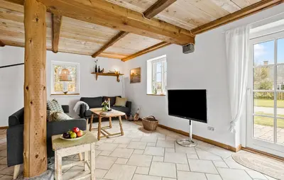 a living room with a tv and a couch at 4 Bedroom Cozy Home In Vestervig in Vestervig