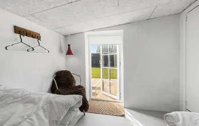 a bedroom with a bed and a window at Lovely Home In Thisted With Wifi in Thisted