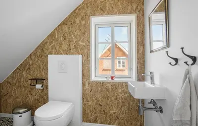 a bathroom with a toilet and a sink and a window at Lovely Home In Thisted With Wifi in Thisted