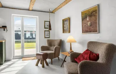 a living room with two chairs and a table at Lovely Home In Thisted With Wifi in Thisted