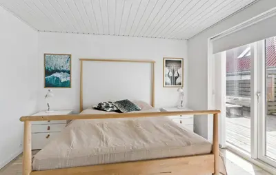 a bedroom with a bed and a window at Lovely Home In Thisted With Sauna in Thisted