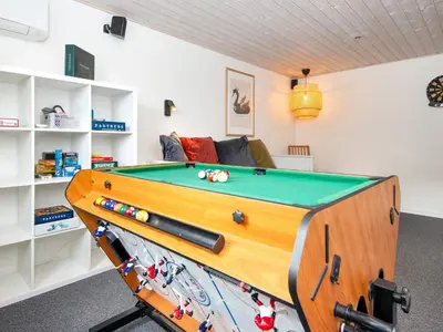 a room with a pool table and a couch at 5 star holiday home in Vinderup-By Traum in Vinderup