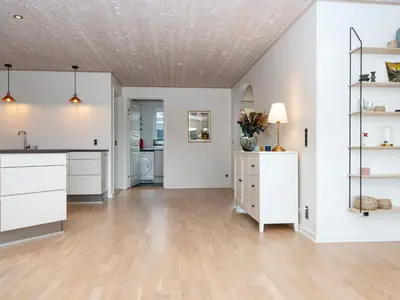 a kitchen with white cabinets and a ceiling at 5 star holiday home in Vinderup-By Traum in Vinderup