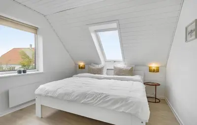 a white bedroom with a bed and a window at 3 Bedroom Beautiful Home In Vesløs in Vesløs