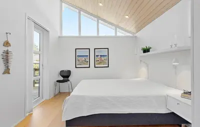 a white bedroom with a large bed and a window at Pet Friendly Home In Farsø With Wifi in Farsø