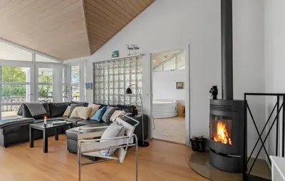 a living room with a couch and a fireplace at Pet Friendly Home In Farsø With Wifi in Farsø