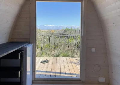 a window in a room with a view of a patio at Camping Vesterhav in Harboør