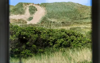 a hill with a dirt road in the middle of a field at Stunning Home In Harboøre With Wifi in Harboør