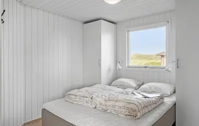 a bed in a white room with a window at Stunning Home In Harboøre With Wifi in Harboør
