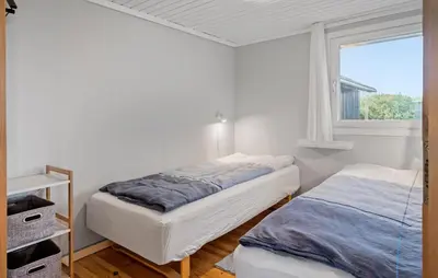 a bedroom with two beds and a window at Nice Home In Lemvig With Wifi in Lemvig